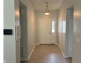 Bright entryway with neutral paint and hardwood flooring at 6926 Trey Dr, Indianapolis, IN 46113