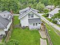 Aerial view highlighting the backyard, fencing, and green space of the property at 113 N Munsie St, Indianapolis, IN 46229