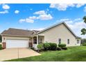 Charming single-story home with a well-manicured lawn, attached garage, and neutral siding at 1163 Meadowlark Dr, Greenwood, IN 46143