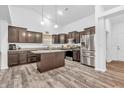 Spacious kitchen with stainless steel appliances, a center island, and ample counter space at 1181 S Aberdeen Dr, Franklin, IN 46131