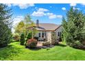 Lush backyard with a pergola and mature trees, offering a serene outdoor space at 15529 Mission Hills Dr, Carmel, IN 46033