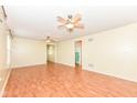 Spacious living room featuring wood-look floors, neutral walls, and a view to other rooms at 15946 Marsala Dr, Fishers, IN 46037