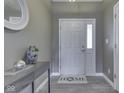 Bright entryway featuring modern decor, gray console table, and a welcoming atmosphere at 2734 Newaygo Dr, Indianapolis, IN 46217