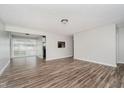 Open-concept living space featuring wood-look floors and freshly painted walls at 4514 Priscilla Ave, Indianapolis, IN 46226