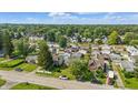 Aerial view showcasing neighborhood homes surrounded by lush greenery and mature trees at 4648 Brookville Rd, Indianapolis, IN 46201