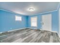 Bright living room with fresh paint, new floors, and natural light, perfect for relaxation at 517 N Alton Ave, Indianapolis, IN 46222