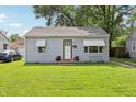 Cozy one-story home with a neat front yard and simple landscaping at 524 S Arlington Ave, Indianapolis, IN 46219
