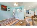 Bright living room featuring a view to the kitchen, with simple decor and neutral tones at 524 S Arlington Ave, Indianapolis, IN 46219