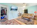Cozy living room with modern decor, neutral rug, and a flat-screen TV at 524 S Arlington Ave, Indianapolis, IN 46219
