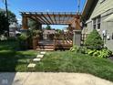 Inviting backyard deck with a pergola, perfect for outdoor relaxation and entertaining at 5786 N Delaware St, Indianapolis, IN 46220