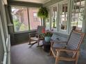 Cozy screened-in front porch with comfortable seating and natural light at 5786 N Delaware St, Indianapolis, IN 46220