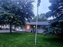 View of the home's front yard, mature trees, and charming exterior at 9470 N Old Port Royal, Martinsville, IN 46151