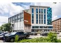 Modern commercial building featuring mixed architectural styles and well-maintained landscaping at 1 Virginia Ave # 607, Indianapolis, IN 46204