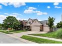 Two-story home with manicured lawn, brick and siding exterior, and a three-car garage in a suburban neighborhood at 10758 Gettysburg Pl, Carmel, IN 46032
