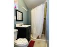 Cozy bathroom featuring a corner shower, vanity with sink, and a toilet at 1358 Hiatt St, Indianapolis, IN 46221