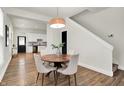 Bright dining area featuring a modern light fixture, and an open concept layout at 1531 English Ave, Indianapolis, IN 46201