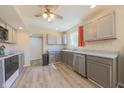 The bright kitchen has stainless steel appliances, ample cabinets, and wood-look floors at 15460 Follow Dr, Noblesville, IN 46060