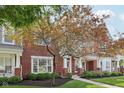 Beautiful brick townhouse with lush landscaping and mature trees at 15553 Portland Dr, Westfield, IN 46074