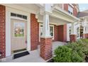 Inviting front porch with brick columns and space for seating at 15553 Portland Dr, Westfield, IN 46074