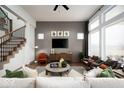 Bright living room featuring large windows, a modern fireplace, and comfortable seating at 20005 Gansett Rd, Westfield, IN 46074