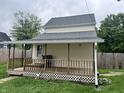 Cozy back porch with wooden railings, perfect for relaxing and enjoying the outdoors at 2244 Lafayette St, Anderson, IN 46012