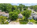 An aerial view of the cozy home nestled in a lush, green neighborhood at 3251 Mars Hill St, Indianapolis, IN 46221