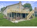 Large wooden deck overlooking the backyard with a hot tub and ample space for entertaining at 3287 Buckmoor Pkwy, Greenwood, IN 46143