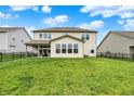 Expansive backyard featuring lush green grass and a black iron fence, perfect for outdoor activities and relaxation at 4250 Blackford Rd, Bargersville, IN 46106
