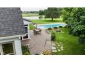 Relaxing backyard with swimming pool, deck and stone fire pit area at 4670 N 600 E, Franklin, IN 46131