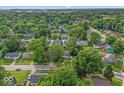 Areal view of a neighborhood full of trees with well maintained homes and lawns at 5614 Regency Dr, Indianapolis, IN 46224