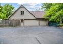 Spacious three-car garage with ample parking space and a private entrance at 7533 Deerfield Dr, Greenfield, IN 46140