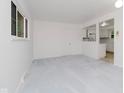 Spacious living room with neutral carpet and plenty of natural light at 8022 Hoover Ln, Indianapolis, IN 46260