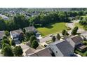 An aerial view of a neighborhood featuring tree-lined streets, well-manicured lawns, and a mix of single-Gathering homes at 13829 Black Canyon Ct, Fishers, IN 46038