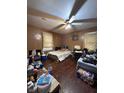 This bedroom boasts two beds, a ceiling fan, and a window for lots of natural light at 1425 Sharon Ave, Indianapolis, IN 46222