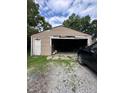 Spacious detached garage with an open door providing storage and parking space at 1425 Sharon Ave, Indianapolis, IN 46222
