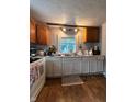 Functional kitchen with white cabinets, wood countertops, and modern appliances at 1728 N Somerset Ave, Indianapolis, IN 46222