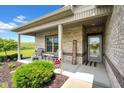 Inviting front porch with comfortable seating, a 