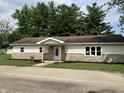 Charming single story home featuring stone facade and cozy front porch at 321 S 23Rd St, Elwood, IN 46036