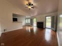 Open living area with hardwood floors, fireplace and French doors to the deck at 3327 Boxwood Dr, Indianapolis, IN 46227