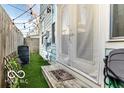 Outdoor area featuring a small patio and artificial turf at 48 E Palmer St, Indianapolis, IN 46225