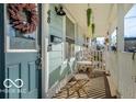 Inviting front porch with seating area and decorative plants at 48 E Palmer St, Indianapolis, IN 46225