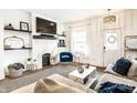 Bright and modern living room with a marble fireplace and stylish decor at 48 E Palmer St, Indianapolis, IN 46225