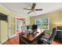 Comfortable home office featuring a large window, a ceiling fan, and ample workspace at 5960 Dado Dr, Noblesville, IN 46062