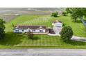Aerial shot of ranch home on a expansive lot with large yard and a detached garage at 5964 N Pr Wind Drift Ln, Shelbyville, IN 46176