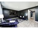 Bright living room with modern furnishings, including a flat-screen TV and comfortable seating at 6332 Card Blvd, Indianapolis, IN 46221