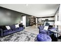 Stylish living room featuring an open floor plan with dark walls and light flooring at 6332 Card Blvd, Indianapolis, IN 46221