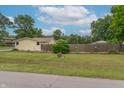 The backyard is fully fenced and showcases the home's large lot with plenty of green space at 6805 Jackson St, Indianapolis, IN 46241