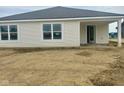 Bright and airy single story home featuring white siding, large windows, and a covered porch at 6812 Rawlings Ln, Indianapolis, IN 46221