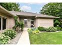 A home entrance with a welcoming walkway and manicured landscaping around the front entrance at 7175 Scarlet Oak Dr, Noblesville, IN 46062