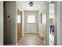 Tiled hallway featuring a closet and access to other rooms at 7736 Wawasee Dr, Indianapolis, IN 46250